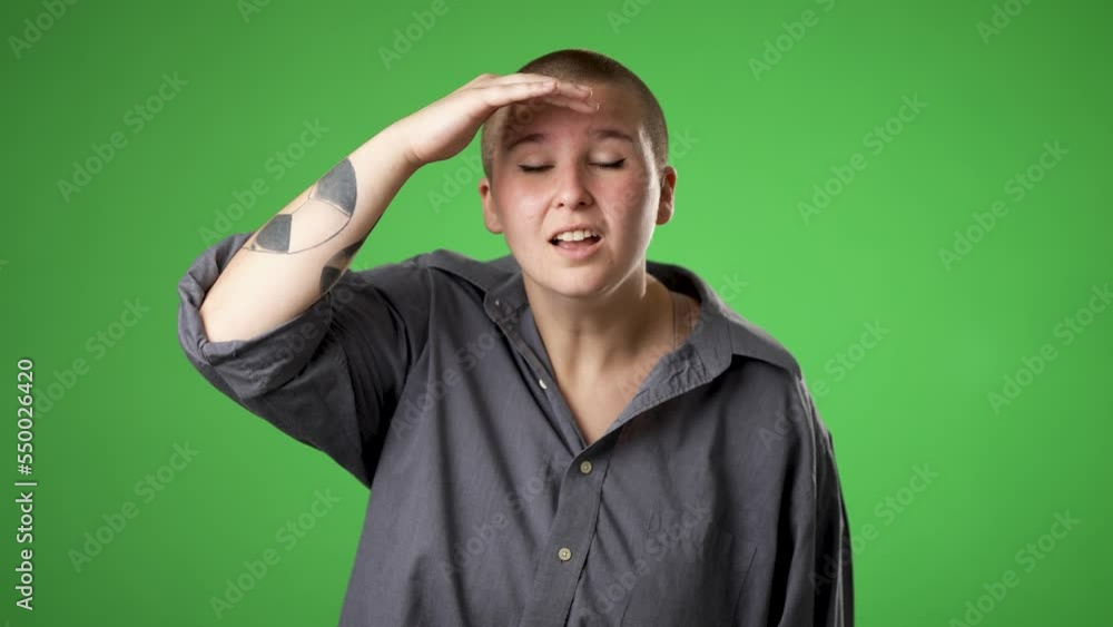Portrait of happy smiling gender fluid non binary young woman 20s smiling and look around for friend find waving meet greet with hand as notices someone isolated on green screen background. Portrait of happy smiling gender fluid non binary young woman 20s smiling and look around for friend find waving meet greet with hand as notices someone isolated on green screen background.