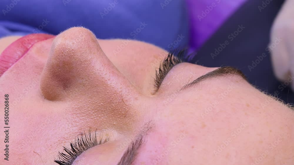 Preparation to the right of the model girl for the permanent procedure. Cosmetic procedure permanent eyebrow makeup. Eyebrow tattooing. Preparation to the right of the model girl for the permanent procedure. Cosmetic procedure permanent eyebrow makeup. Eyebrow tattooing.