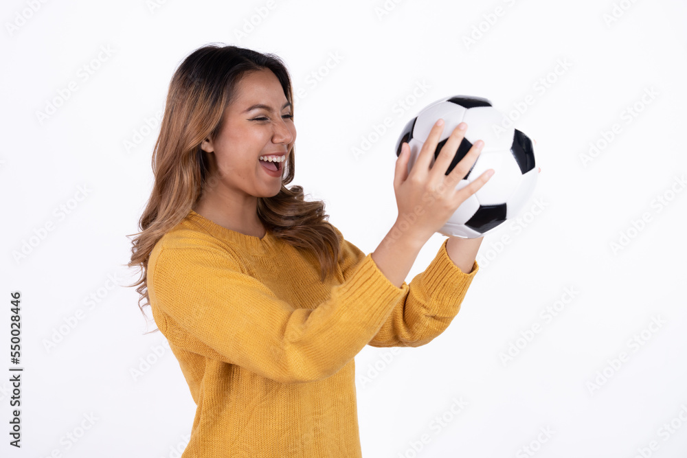 Happy Asian woman football fan cheer up support favorite team with soccer ball isolated on white background. Happy Asian woman football fan cheer up support favorite team with soccer ball isolated on white background.