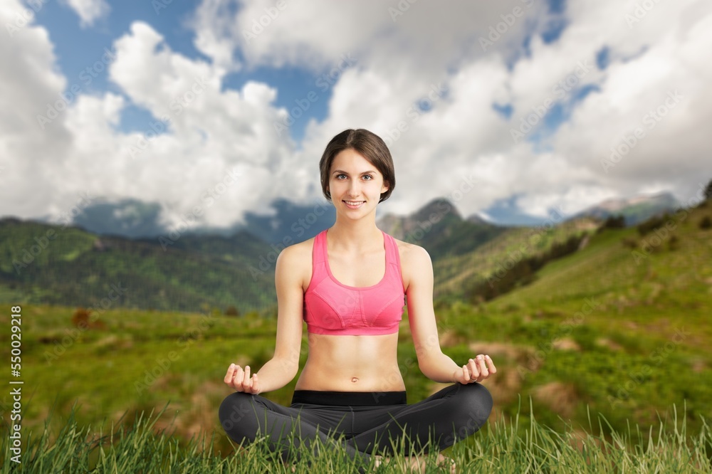 Young happy woman do yoga on outdoor