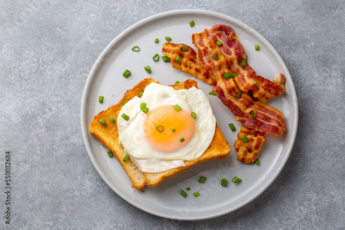 Fried eggs with bacon. Baco...