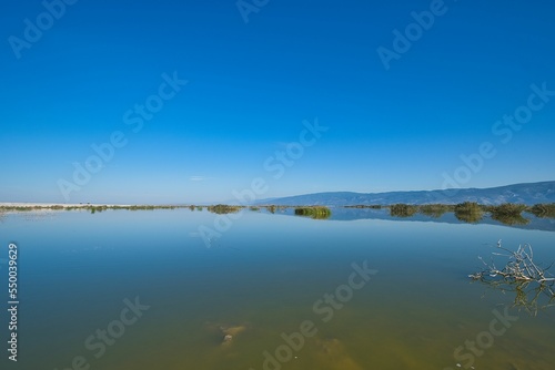 calm lake with blue sky. Lake Karla, Greece photo