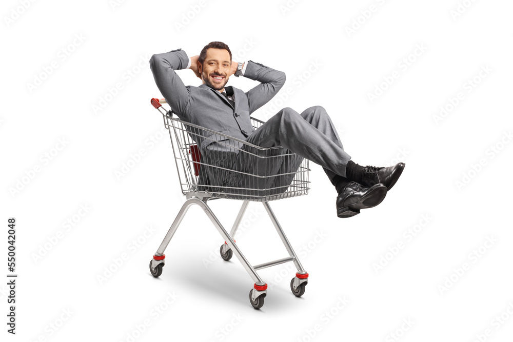 Young professional man sitting inside a shopping cart Young professional man sitting inside a shopping cart