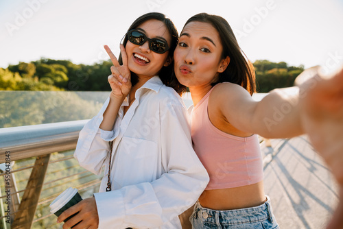 Selfie of young cute asian woman with puckered lips