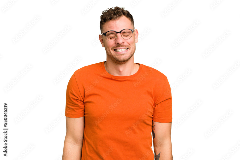 Young caucasian handsome man isolated laughs and closes eyes, feels relaxed and happy. Young caucasian handsome man isolated laughs and closes eyes, feels relaxed and happy.