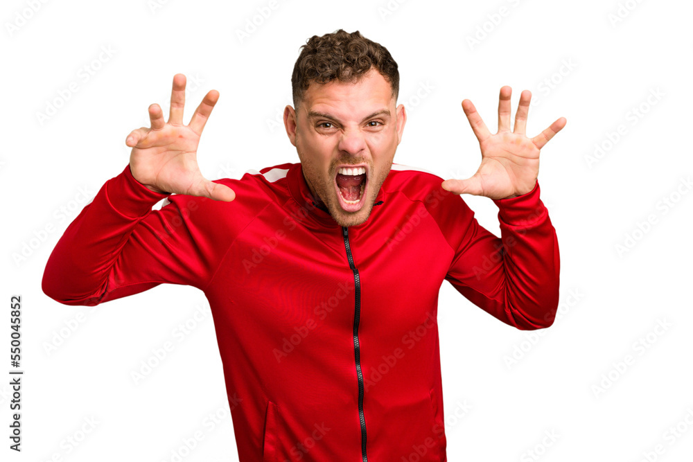 Young caucasian handsome man isolated showing claws imitating a cat, aggressive gesture. Young caucasian handsome man isolated showing claws imitating a cat, aggressive gesture.