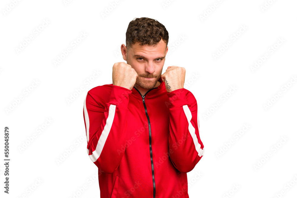 Young caucasian handsome man isolated throwing a punch, anger, fighting due to an argument, boxing. Young caucasian handsome man isolated throwing a punch, anger, fighting due to an argument, boxing.