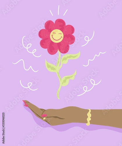 Hand holding up flower