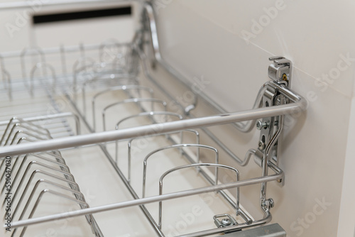 open drawer with utensil holders in the kitchen