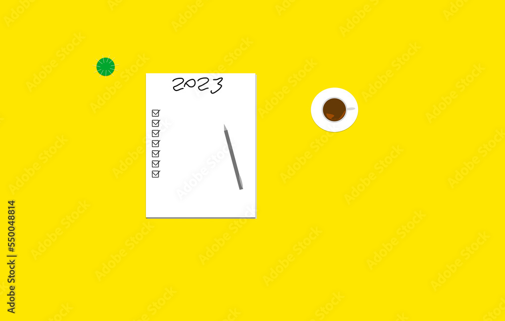 New year goals 2023 on desk. 2023 goals list with notebook, coffee cup, plant on yellow table