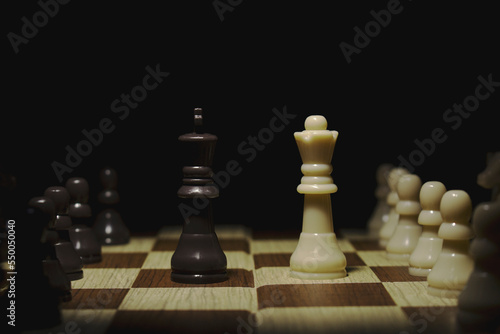 photography chess game  king against queen  fight against power