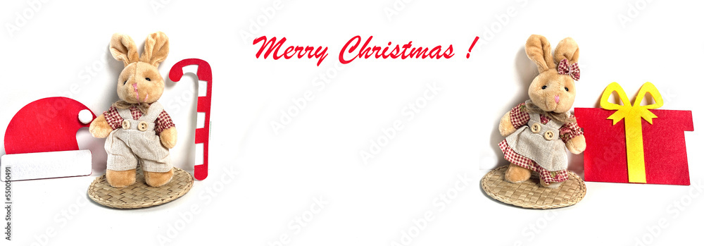 New Year Banner with toy Christmas rabbits, 2023 animal, Santa Claus hat on white background. Lettering Merry Christmas. Greeting card. Copy space.