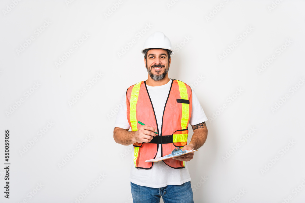 Construction Home Inspector Reviews Documents on studio white background with white helmet Construction Home Inspector Reviews Documents on studio white background with white helmet