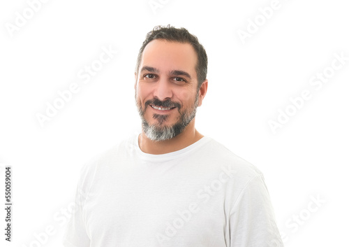 portrait of a bearded middle-aged man looking thoughtfully at the camera over a white studio background