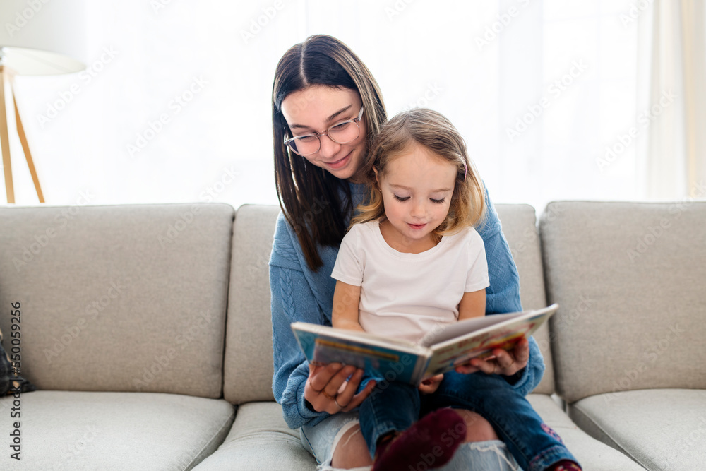 Ταπετσαρία happy kid sitting on sofa with babysitter teen holding book