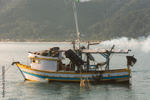 Canvastavla Shrimp fishing boat at sunset in São Sebastião bay, Brazil.