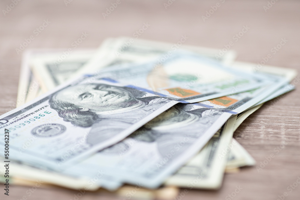 Closeup Of Fifty Dollar Bills On Wooden Table. Fifty Dollar Stock