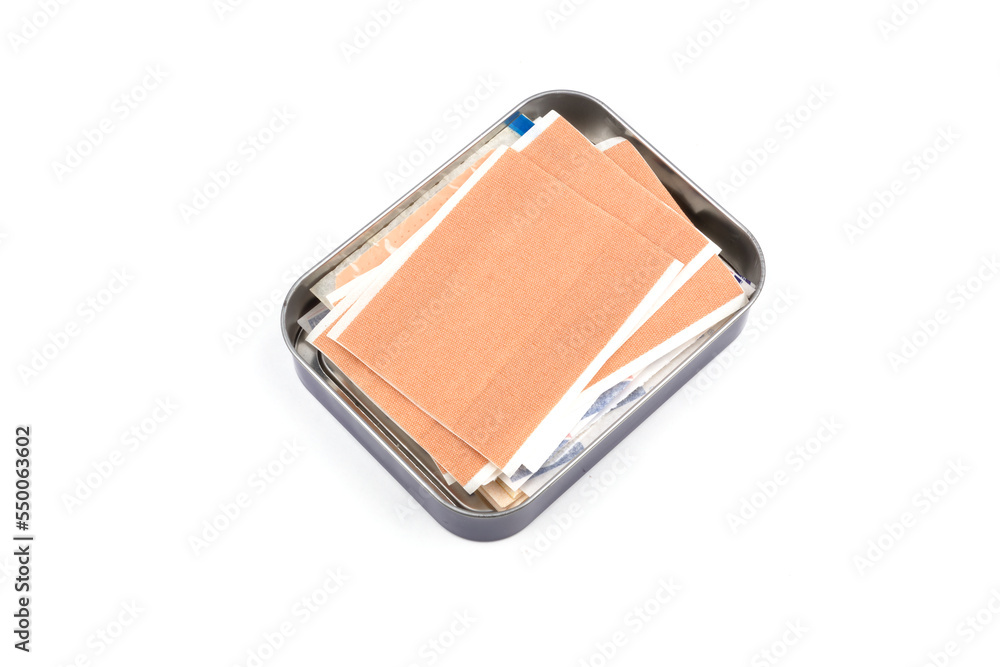 some band-aid isolated on white background with metal box some band-aid isolated on white background with metal box