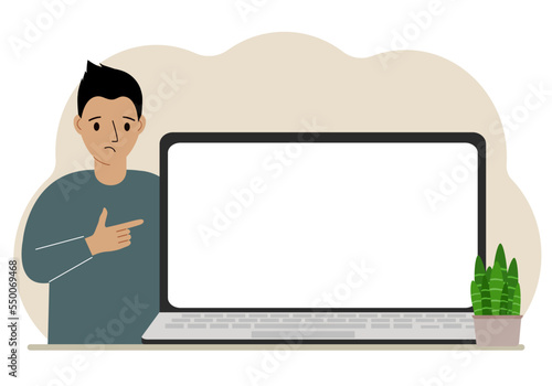 A man next to a large laptop with plenty of space for text.