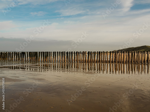 Ocean view in Domburg, Netherlands. Beautiful wooden pole at the beach