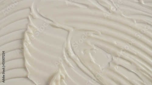 Cream for face, smear, concealer, cosmetic liquid foundation, cream smudge, makeup brush. Motion of the beauty skincare product sample. Slow motion. High quality 4k footage