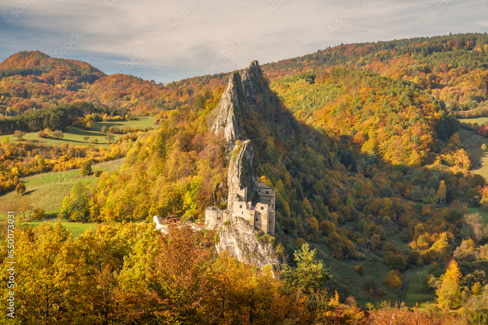 View of autumn landscape with The Lednica medieval castle in the White Carpathian Mountains, Slovakia, Europe.