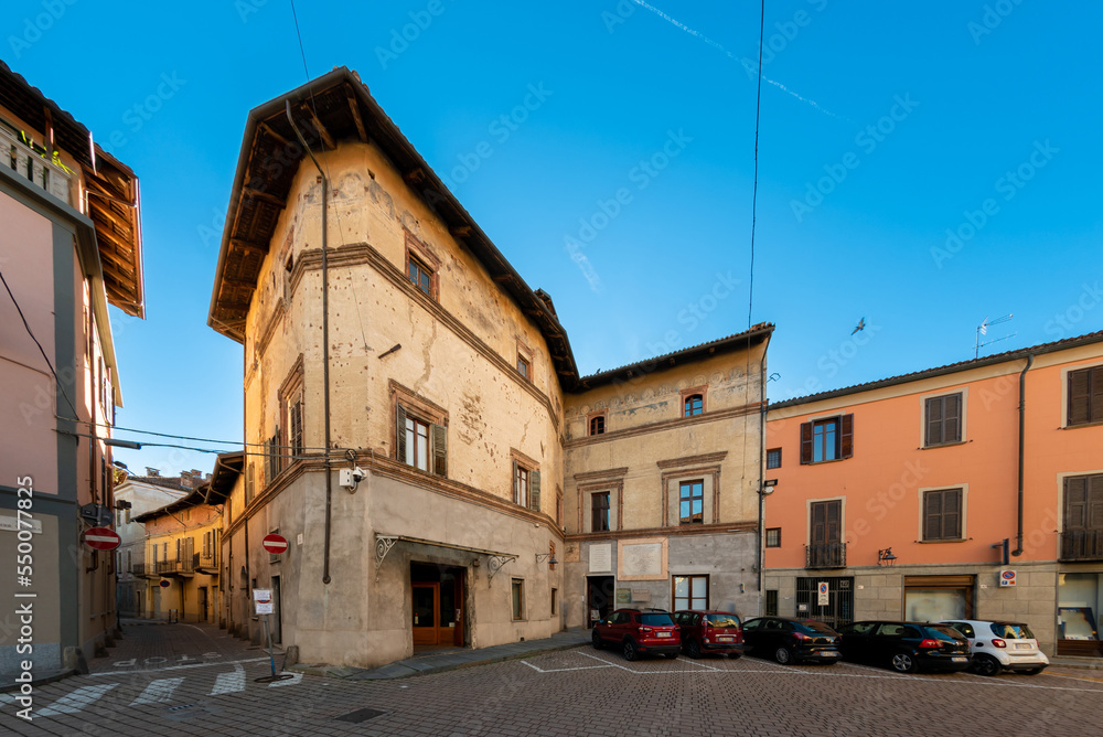 Carmagnola, Turin, Italy - November 05, 2022: Casa Cavassa (Cavassa House 15th century) seat of the Francesco Bussone Mutual Aid Society Operaria in via Ferruccio Valobra in the historic center
