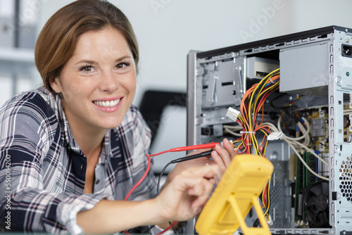 happy woman holds measures pc cables