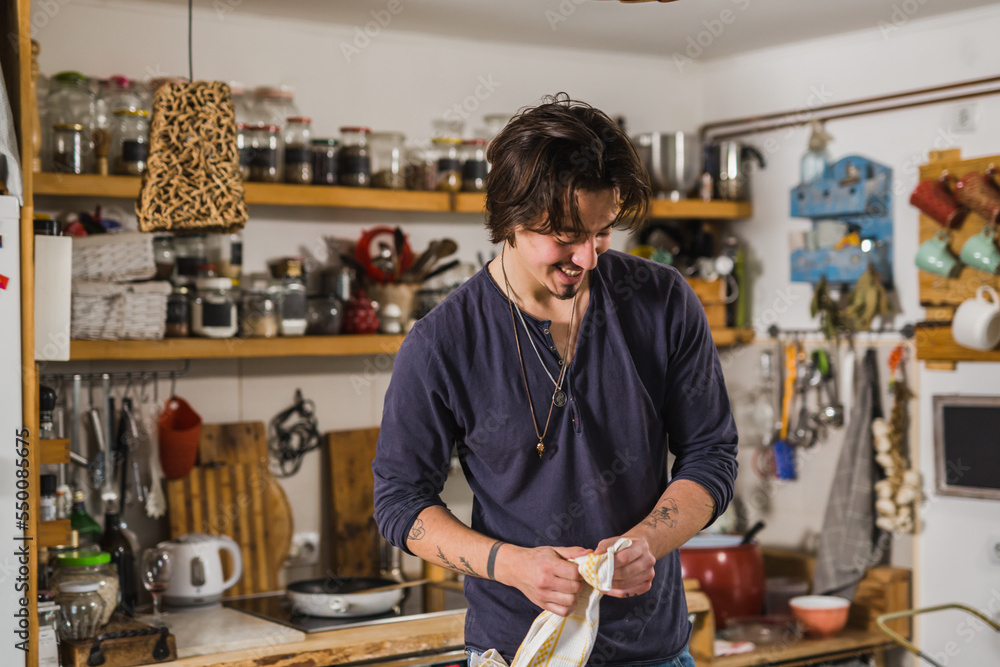 Fototapeta premium Handsome young man in the kitchen