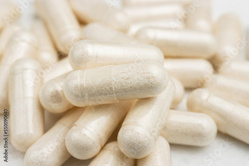 White medicine capsules, vitamin pills or drugs, medication treatment, health care concept