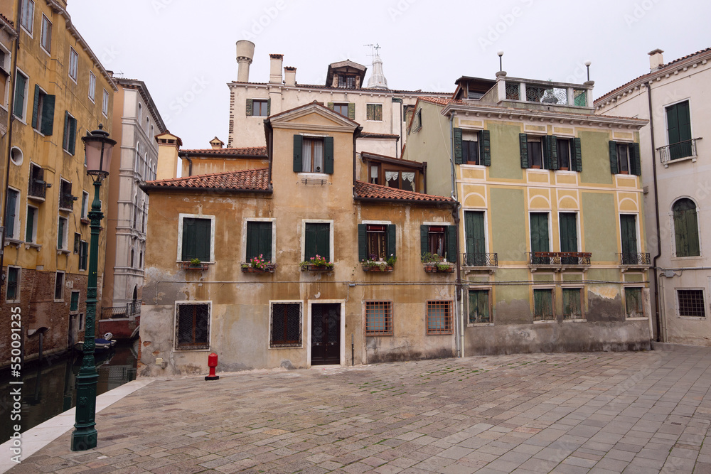 Venice. Old medieval facades of traditional Venetian houses.