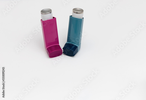 Asthma medications inhalers on a white background. photo