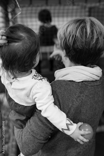 mom with baby in her arms back