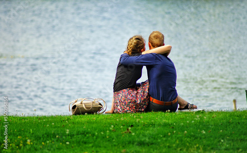 couple sitting on grass