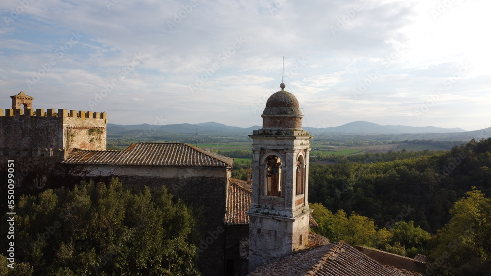 Naklejka premium A church with a bell tower, a castle with a beautiful landscape