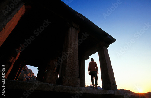 Silhouette in Temple at sunset, Hampi, India. photo