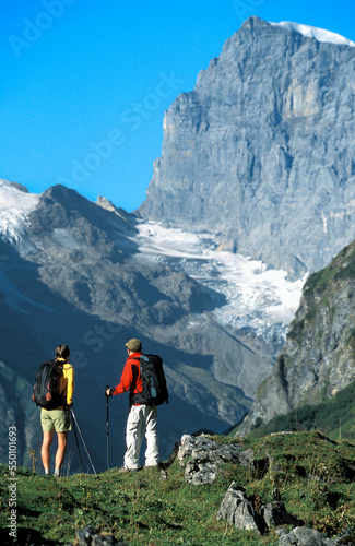 Couple looking at Titlis. Engleberg, Switzerland. photo