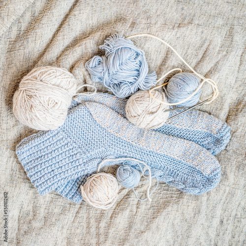 Hand knitted socks,knitting needles and yarn balls. Flat lay. Handmade hobby