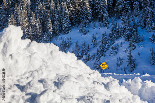 Pile of snow near Snow Slide Area sign, Kebler Pass, Crested Butte, Colorado, USA photo