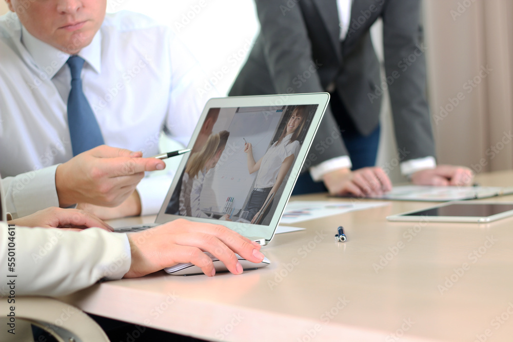 Online remote business presentation is on a laptop in the office Online remote business presentation is on a laptop in the office