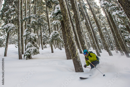 Telemark skiing throught the trees at Yodelin ski area, near Stevens Pass, Washington. photo