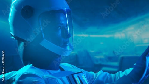 Wallpaper Mural A woman astronaut in a space suit aboard the orbital station. A young female cosmonaut pilots a spaceship. Galactic travel and science concept. Torontodigital.ca