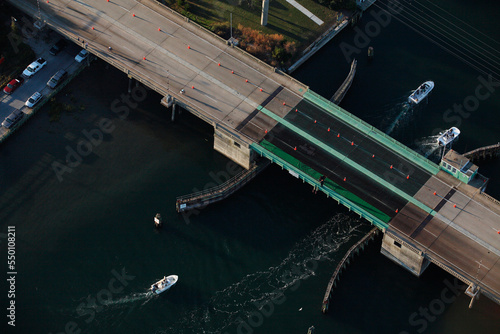 An aerial view of boats passing under a drawbridge in Wrightsville Beach, NC. photo