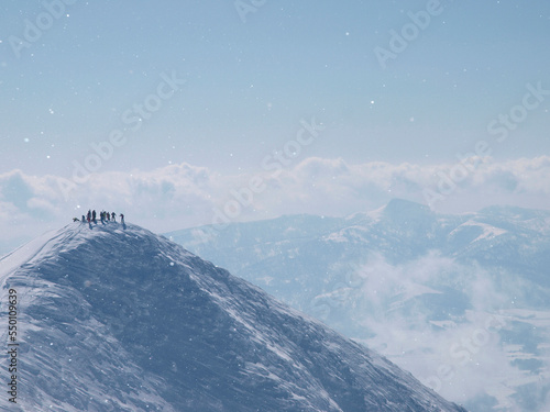 Skiers on top of the Annupuri mountain, a volcano in Niseko, Japan. photo