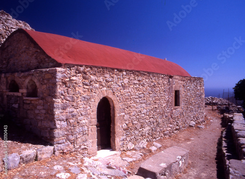 Outside the  17th C Church of Timia Zoni in the deserted village of Mikro Horio, Tilos, Greece photo