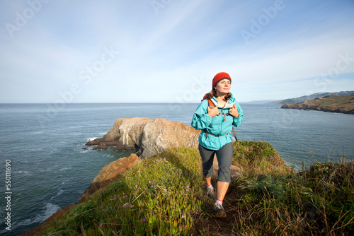 Young woman hiking in the Marin Headlands. Golden Gate National Recreation Area. San Francisco, CA photo