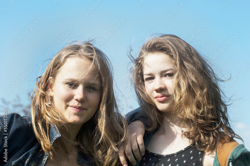 Teenage girls posing and smiling, Freiburg im Breisgau, Baden-Württemberg, Germany