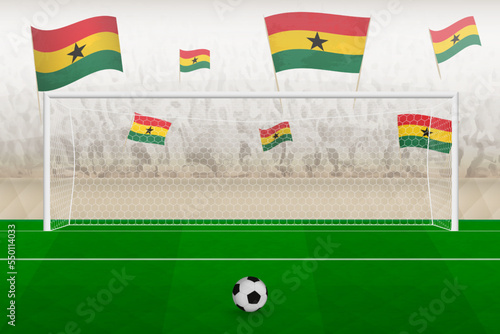 Ghana football team fans with flags of Ghana cheering on stadium, penalty kick concept in a soccer match.