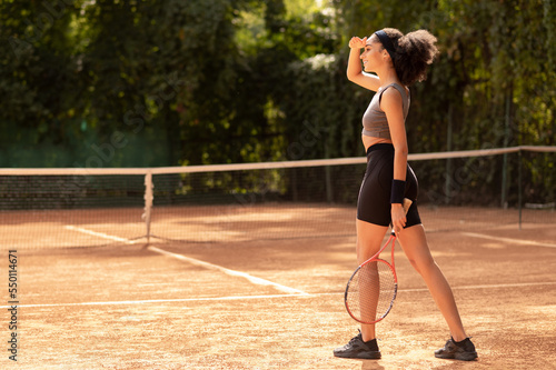 Young dark-haired girl in sportswear having a workout