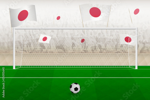 Japan football team fans with flags of Japan cheering on stadium, penalty kick concept in a soccer match.